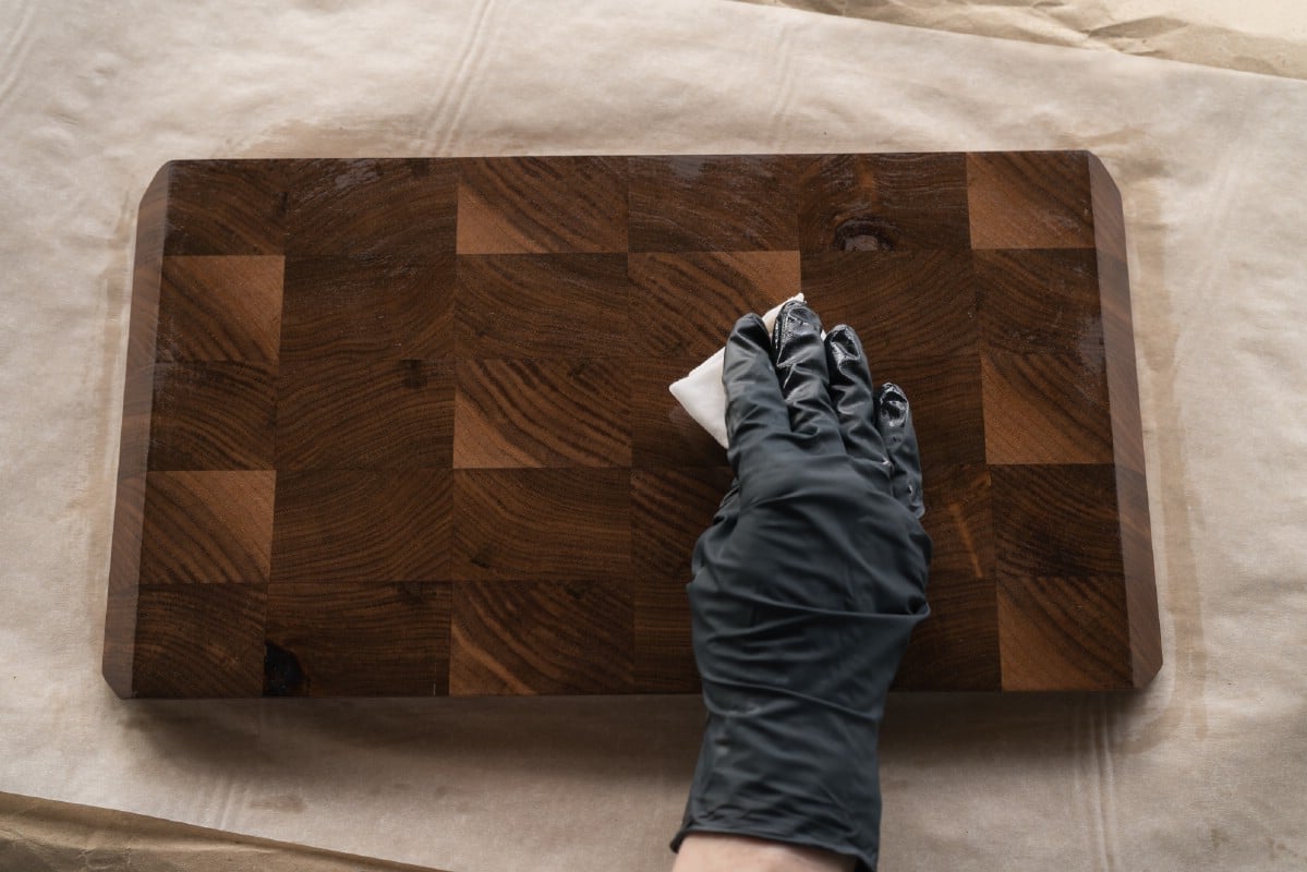 Applying walnut oil finish to a cutting board.