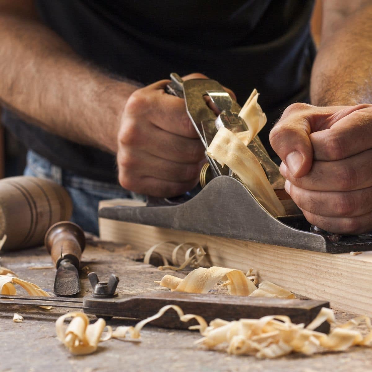 Preparing wood in woodworking shop.